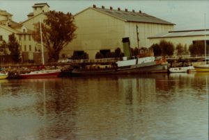 Yelta outside the CSR Refinery. The tug can be seen here painted many colours, occurring after its retirement. (Post 1977).